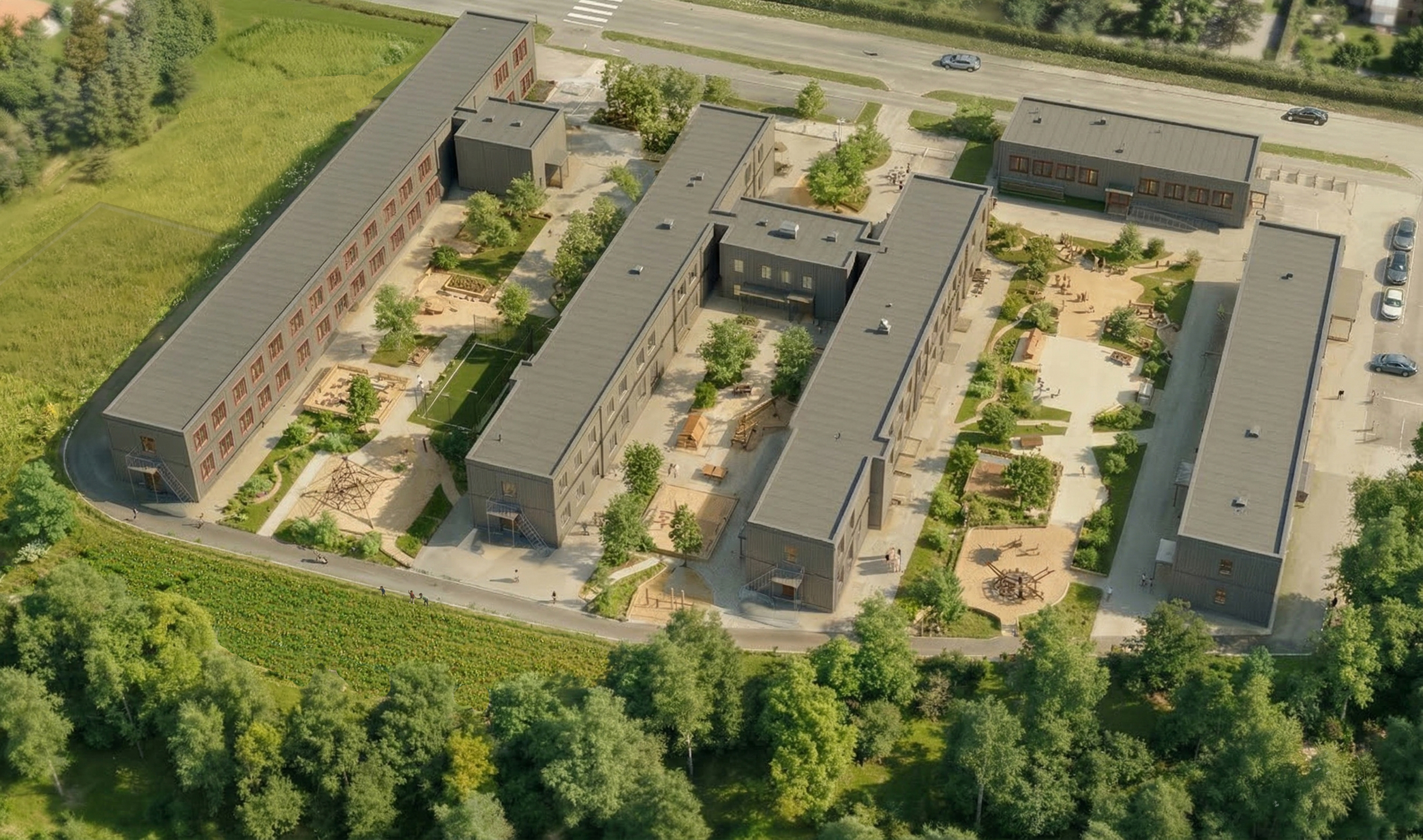 Illustration över en ny modulskola som ska byggas på en stor gräsyta.